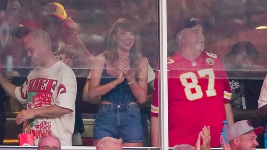 Taylor Swift cheers alongside George Kelce during the first half of the Kansas City Chiefs' game against the Baltimore Ravens. (USA TODAY Sports via Reuters Con)