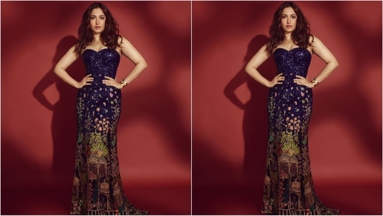 Her dress, designed by renowned fashion designer Rahul Mishra, features a plunging neckline, a shimmering dark violet hue and a charming multi-coloured print at the bottom, making it nothing less than a masterpiece. (Instagram/@tamannaahspeaks)