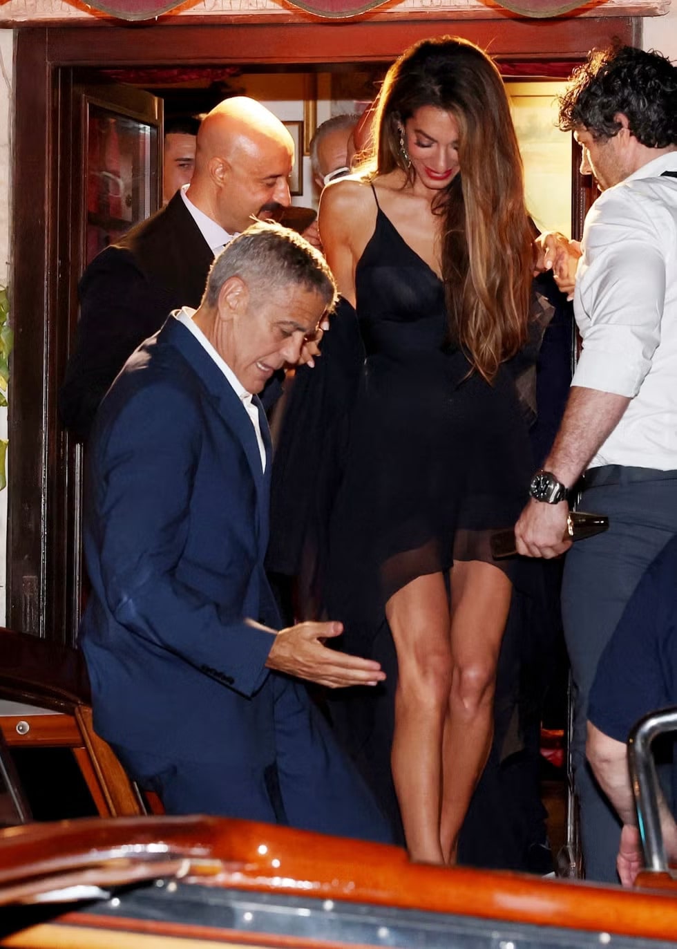 Amal Clooney and George Clooney connected as they left the restaurant. (Instagram)