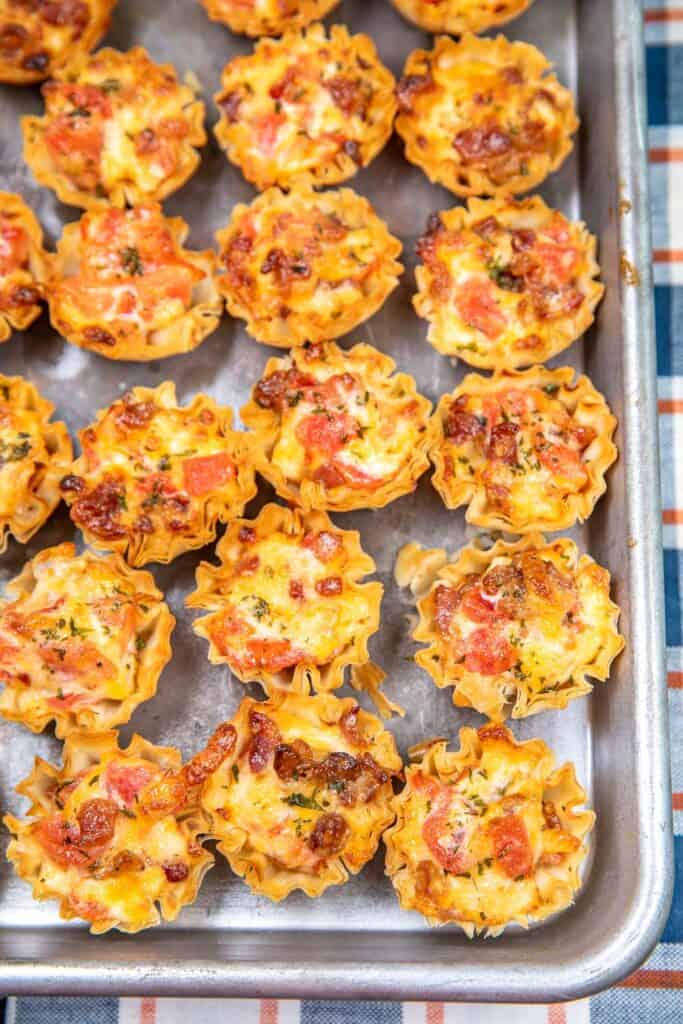 Baking sheet with bacon and Rotel phyllo cups