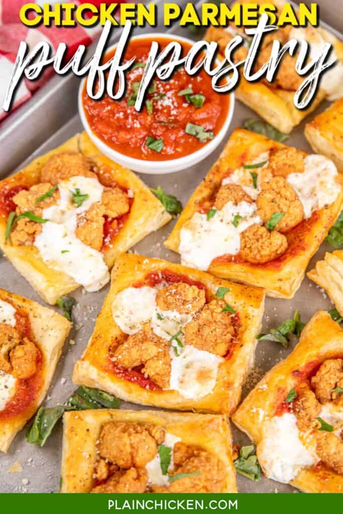 Chicken Parmesan Puff Pastry Bites on a Baking Sheet with Pizza Sauce and Text Overlay