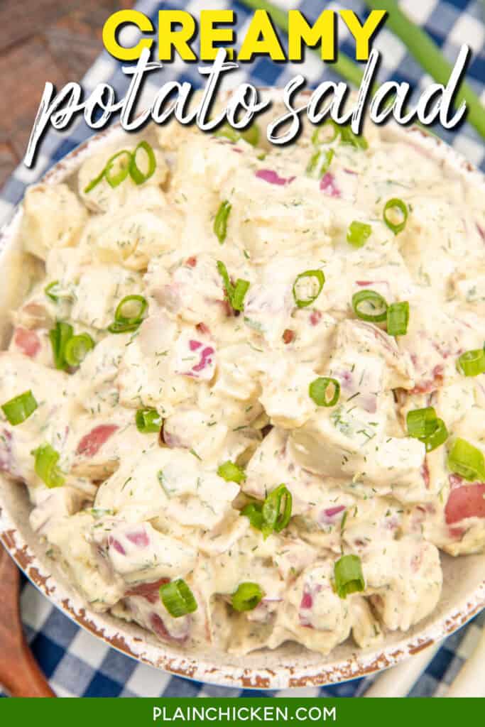 Bowl of creamy German potato salad with text overlay