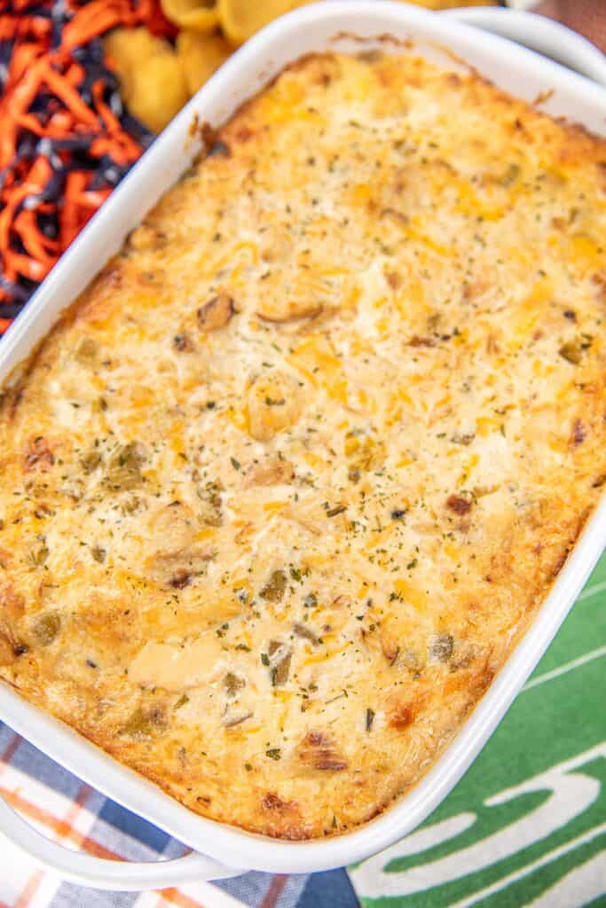 Baking dish with chicken sauce on a table