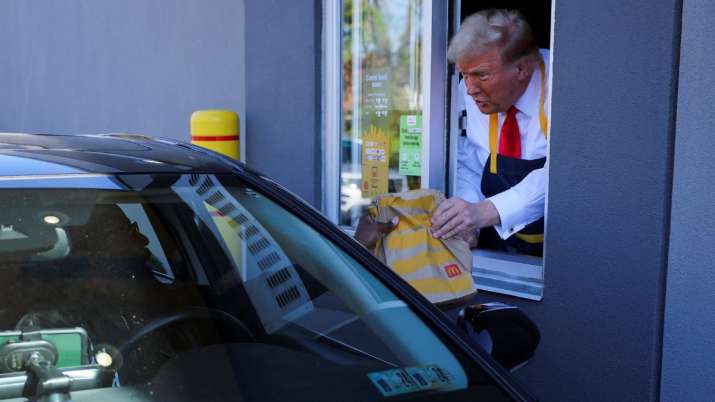 India Tv - Donald Trump serves food at a McDonalds restaurant 