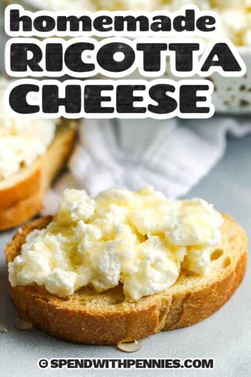 Close up of homemade ricotta cheese on a piece of bread with a caption