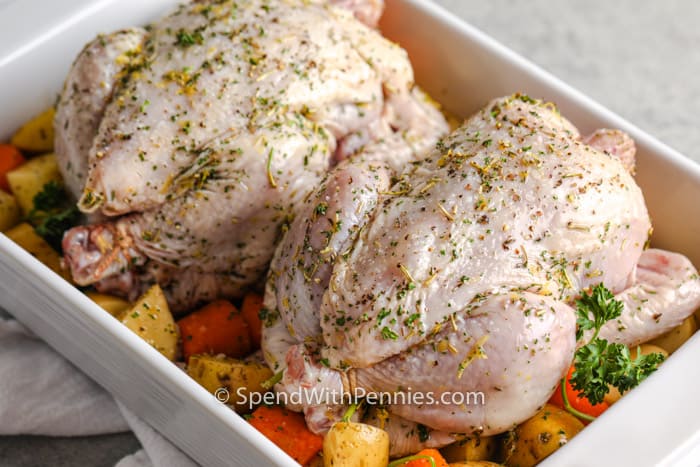 Roasted Cornish hen before cooking in a casserole