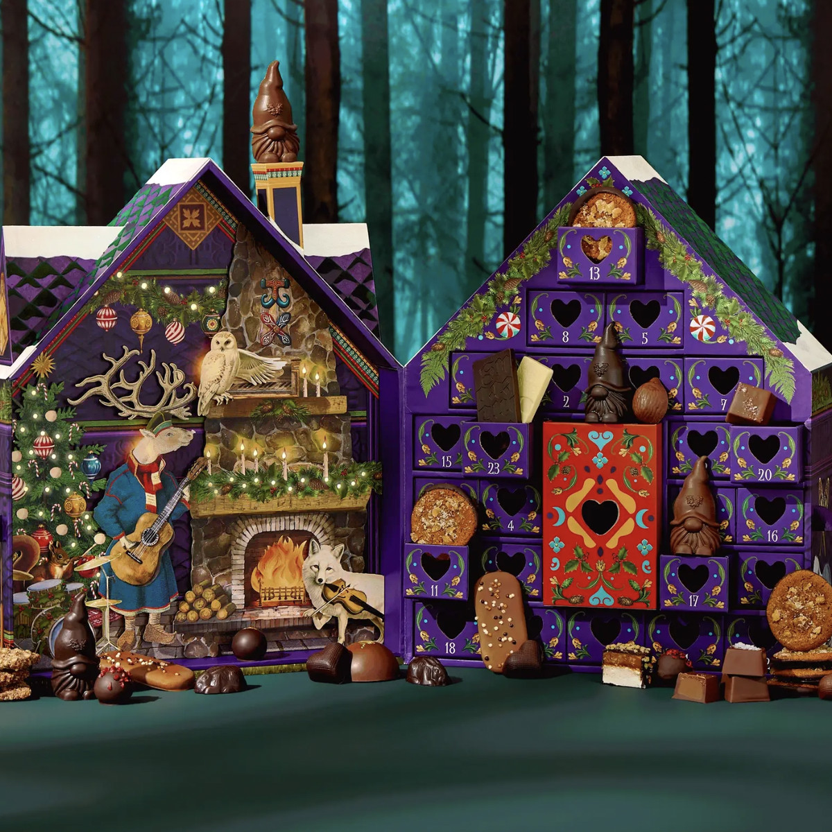 Intricate advent calendar shaped like a house and chocolates.