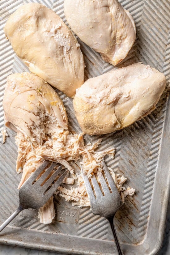 Forks for shredding cooked chicken breasts